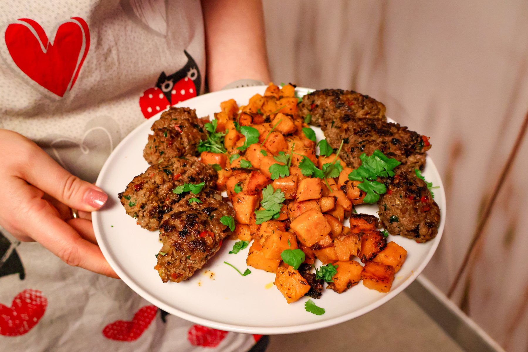Plate with sweet potatoes and patties