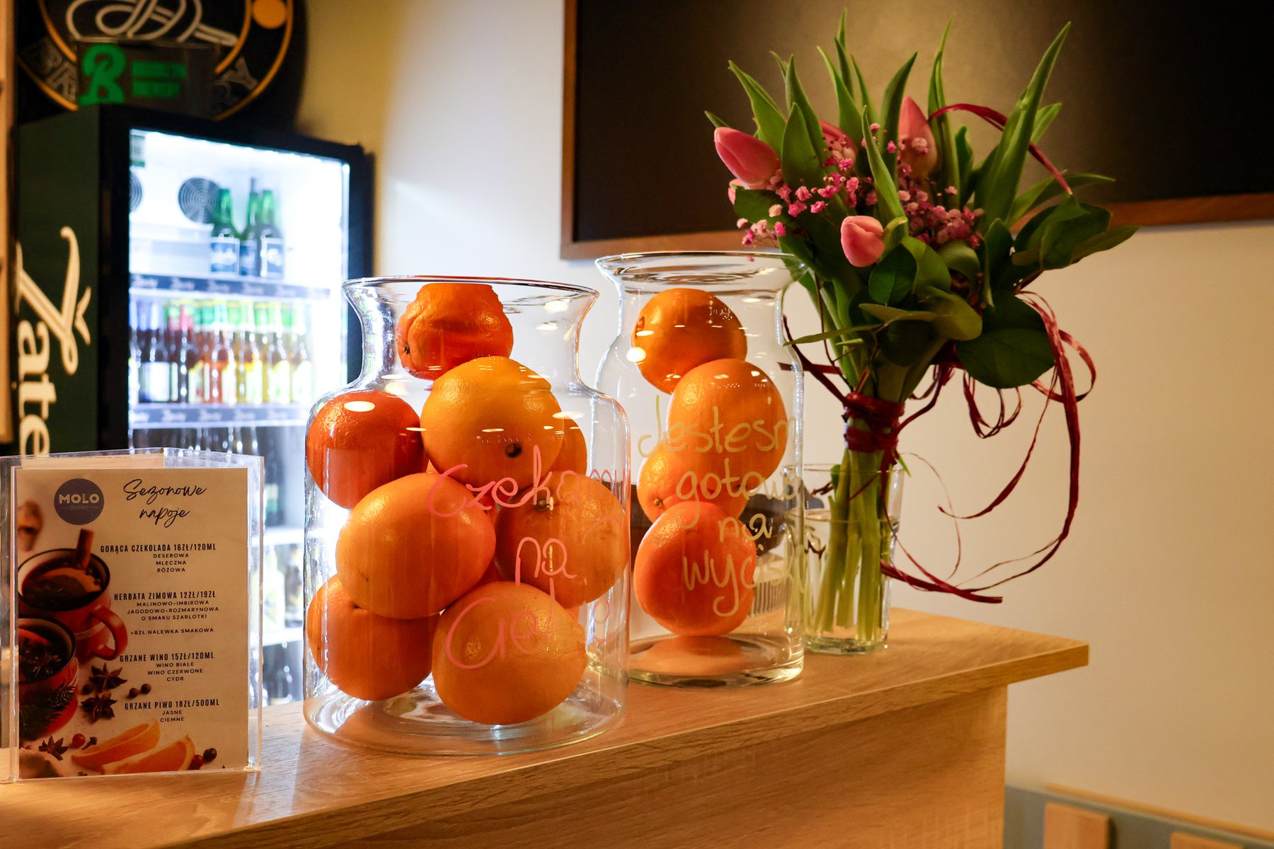 MOLO counter — oranges, pink tulips and seasonal drinks